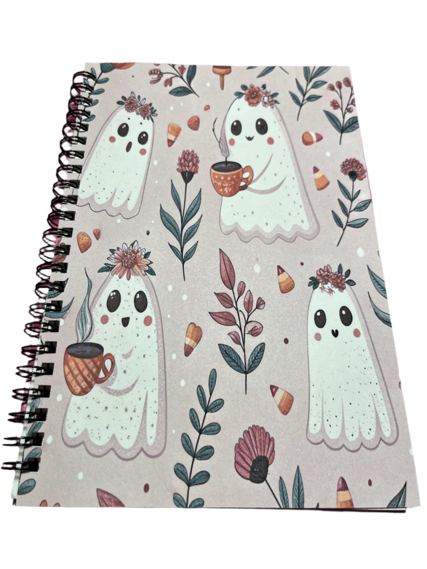 Notebook with ghost illustrations and floral patterns