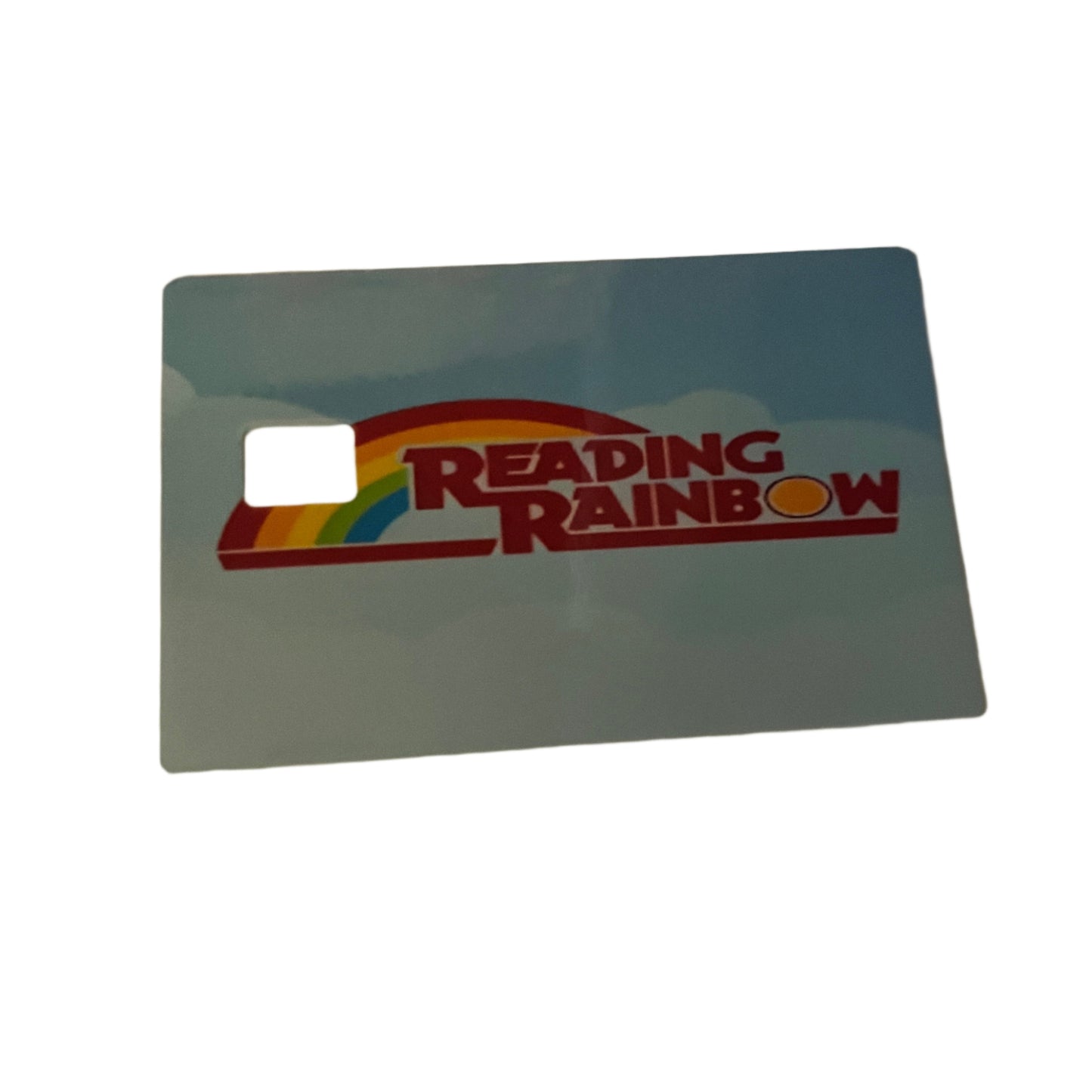 Reading Rainbow card with a rainbow design on a light blue background
