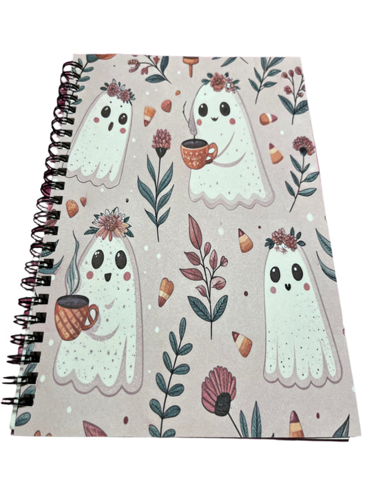 Notebook with ghost illustrations and floral patterns 