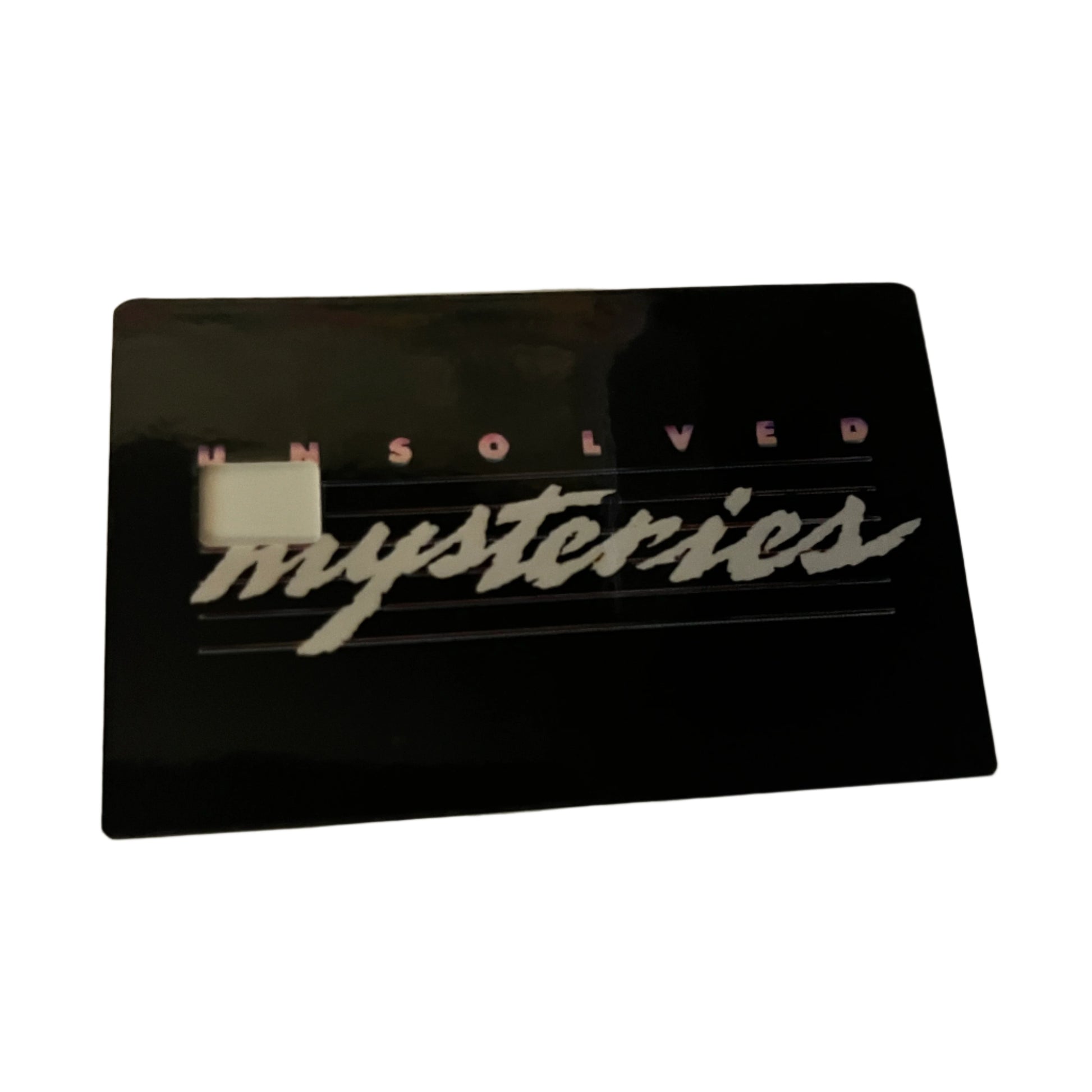 Black card with 'Unsolved Mysteries' text 